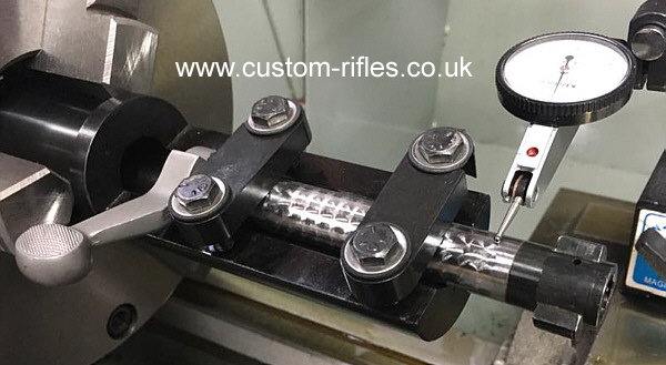 Bolt in jig being machined true.